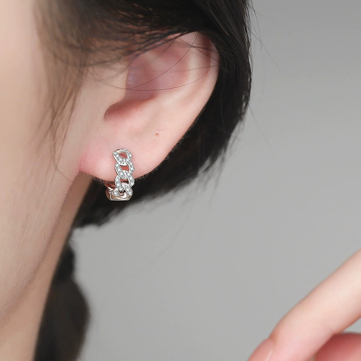 Openwork Pave Moissanite Hoop Earrings in White Gold-Plated S925 Sterling Silver worn on ear by model