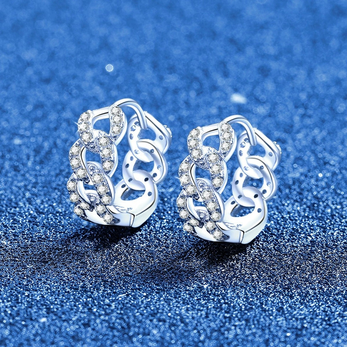 Openwork Pave Moissanite Hoop Earrings in White Gold-Plated S925 Sterling Silver blue scene angled view