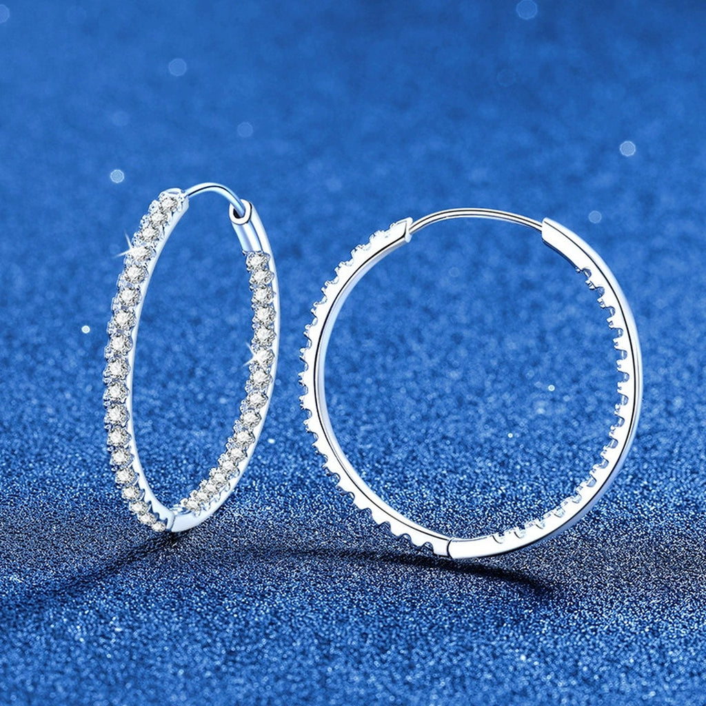 Large Pave Moissanite Hoop Earrings in White Gold-Plated S925 Sterling Silver blue scene angled view