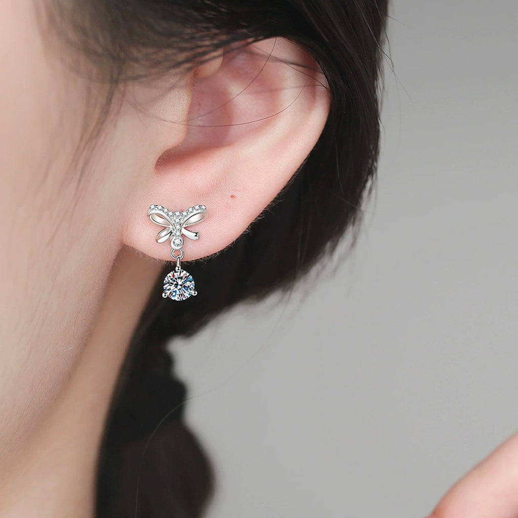Butterfly Moissanite Drop Earrings with CZ in White Gold-Plated S925 worn on ear by model