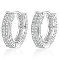 Pavé Moissanite Hoop Earrings in White Gold-Plated S925 Silver on clean white background showing the pair and wide pavé hoop earrings with rows of small moissanite stones