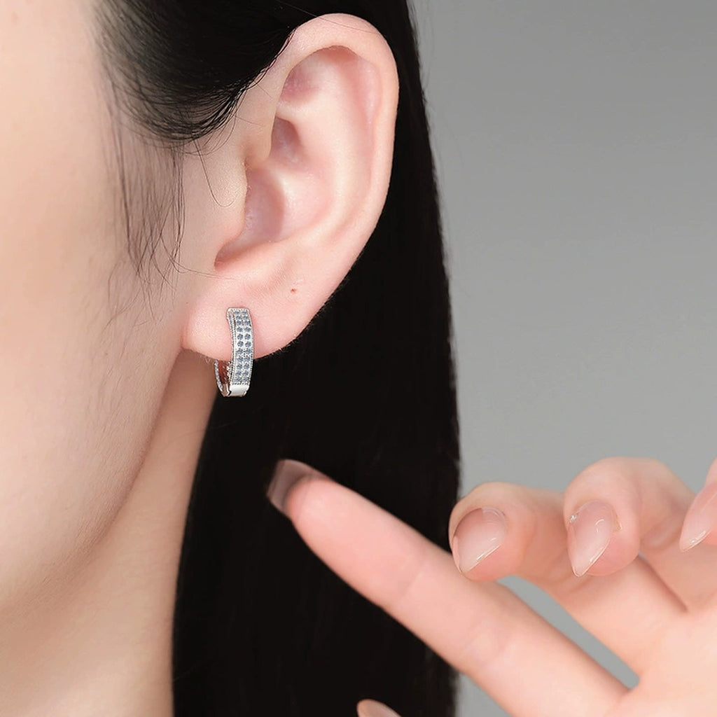 Pavé Moissanite Hoop Earrings in White Gold-Plated S925 Silver worn on ear by model