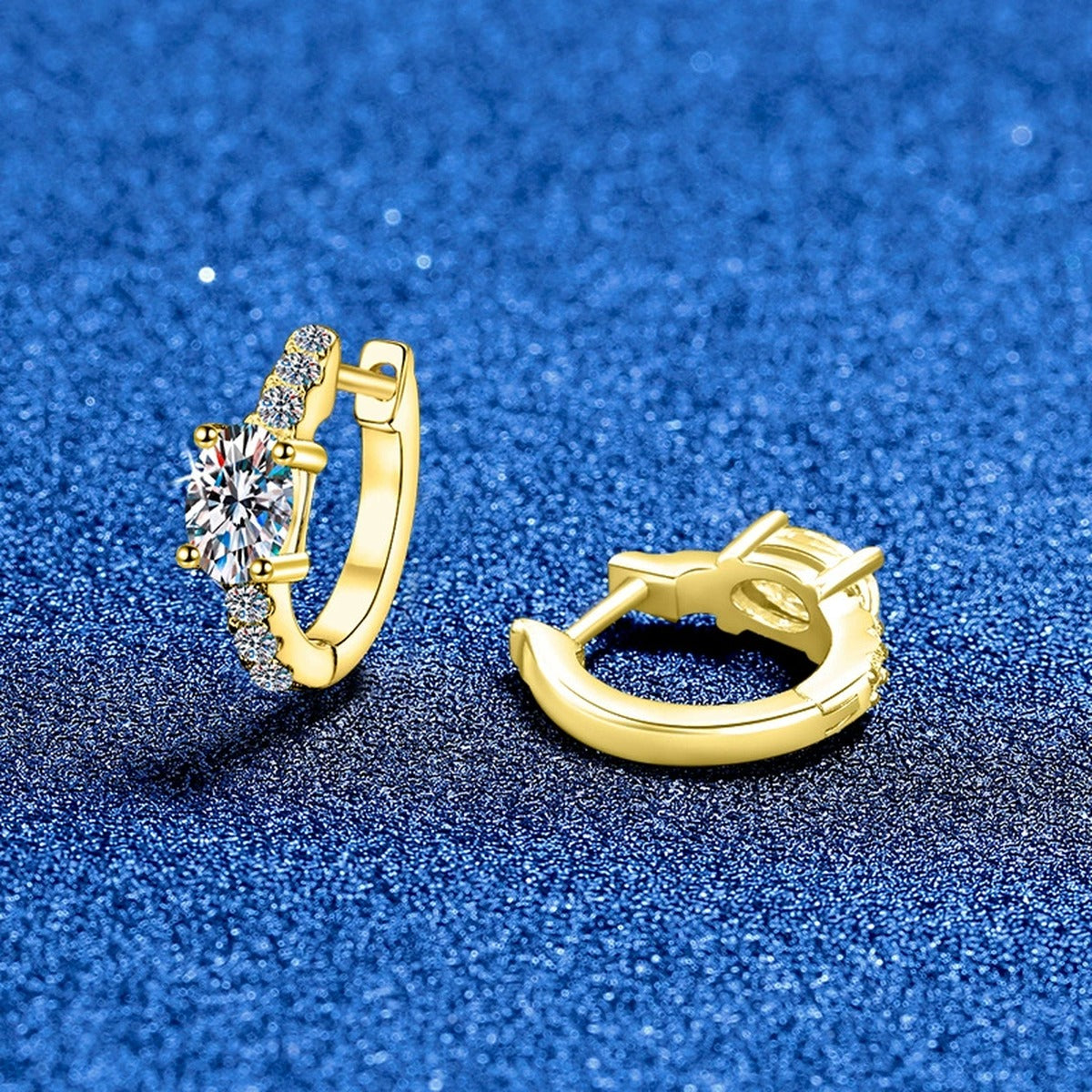 Round Moissanite Huggie Hoop Earrings with CZ in White Gold-Plated S925 Sterling Silver blue scene close-up view