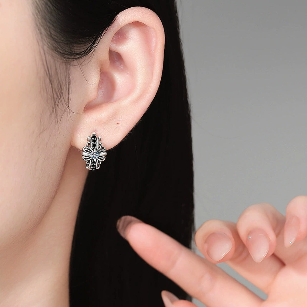 Floral Moissanite Hoop Earrings with CZ in White Gold-Plated S925 Sterling Silver worn on ear by model