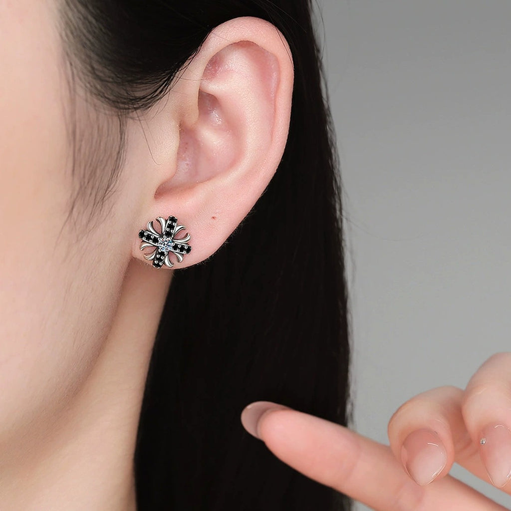 Cross Flower Moissanite Stud Earrings with CZ in White Gold-Plated S925 Sterling Silver worn on ear by model