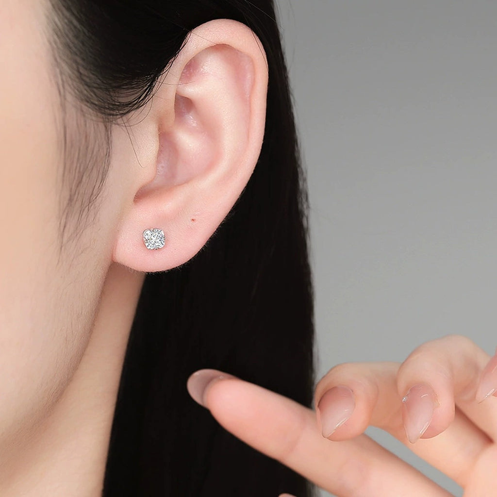 Round Moissanite Stud Earrings in White Gold-Plated S925 Sterling Silver worn on ear by model
