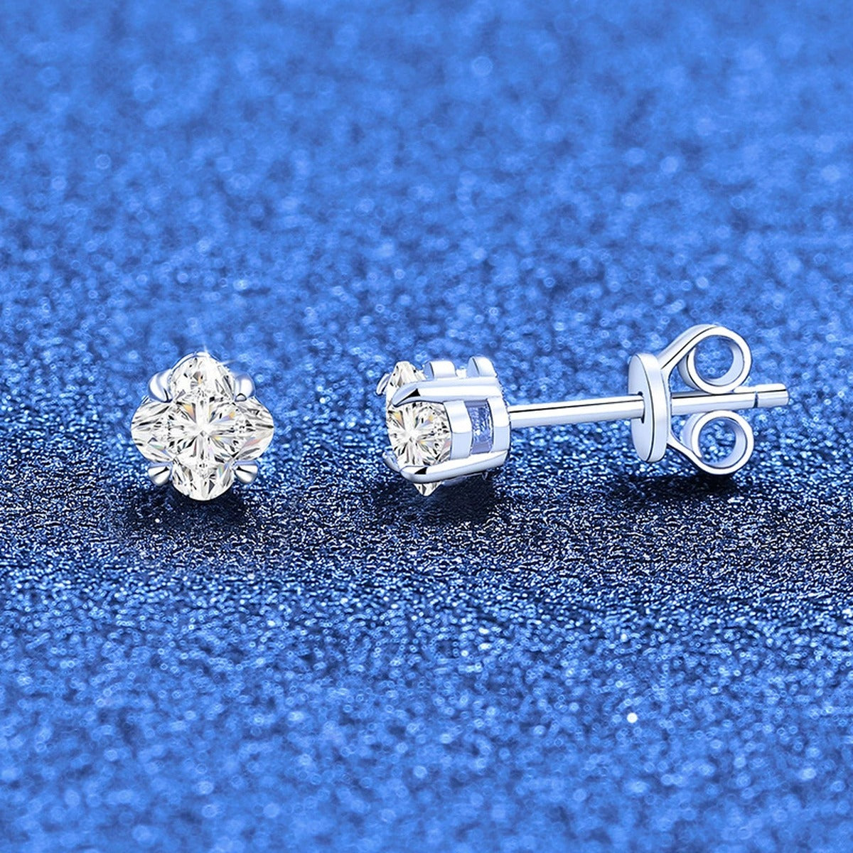 Round Moissanite Stud Earrings in White Gold-Plated S925 Sterling Silver blue scene angled view