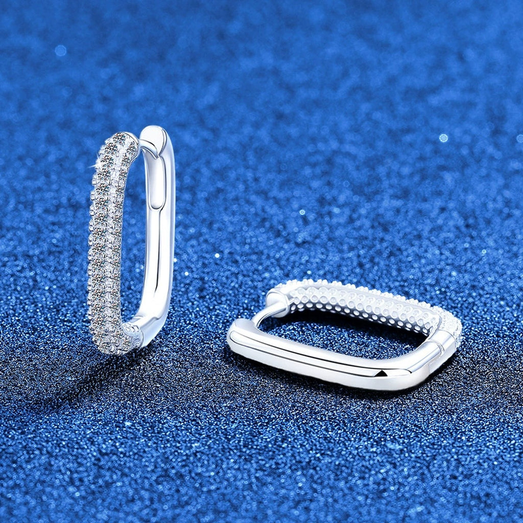 Elongated Pave Moissanite Hoop Earrings in White Gold-Plated S925 Sterling Silver blue scene angled view