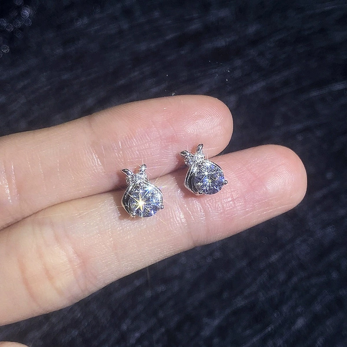 Pear-Shaped Bow Moissanite Stud Earrings in White Gold-Plated S925 Sterling Silver with CZ close-up product detail view