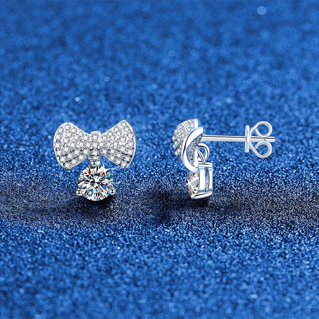 Bow Drop Moissanite Stud Earrings in White Gold-Plated S925 Sterling Silver with CZ blue scene angled view