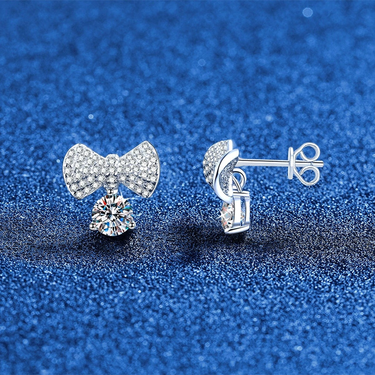 Bow Drop Moissanite Stud Earrings in White Gold-Plated S925 Sterling Silver with CZ blue scene angled view