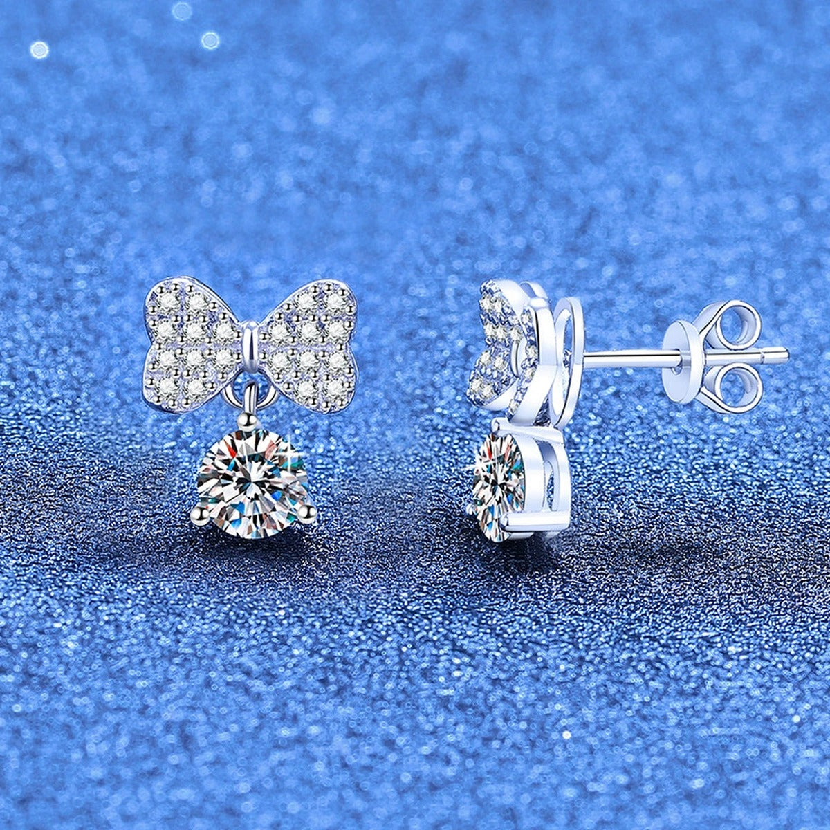 Ribbon Bow Moissanite Drop Earrings in White Gold-Plated S925 Sterling Silver with CZ blue scene angled view
