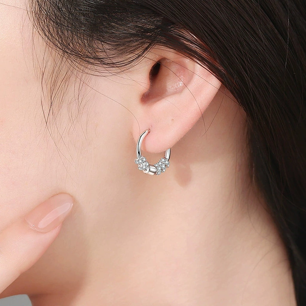 Pave Cluster Moissanite Hoop Earrings in White Gold-Plated S925 Sterling Silver worn on ear by model