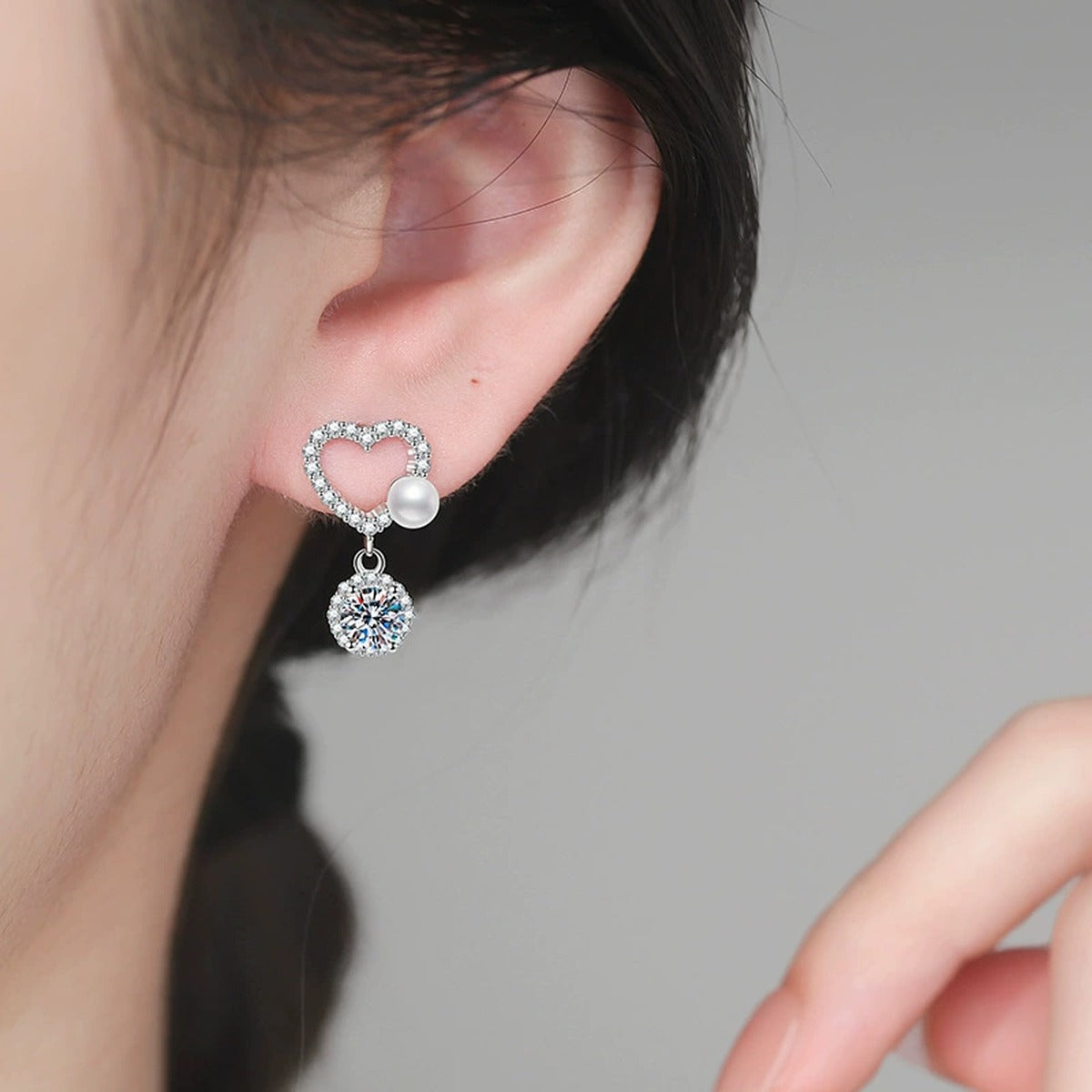 Pearl Heart Moissanite Drop Earrings in White Gold-Plated S925 Sterling Silver with CZ worn on ear by model