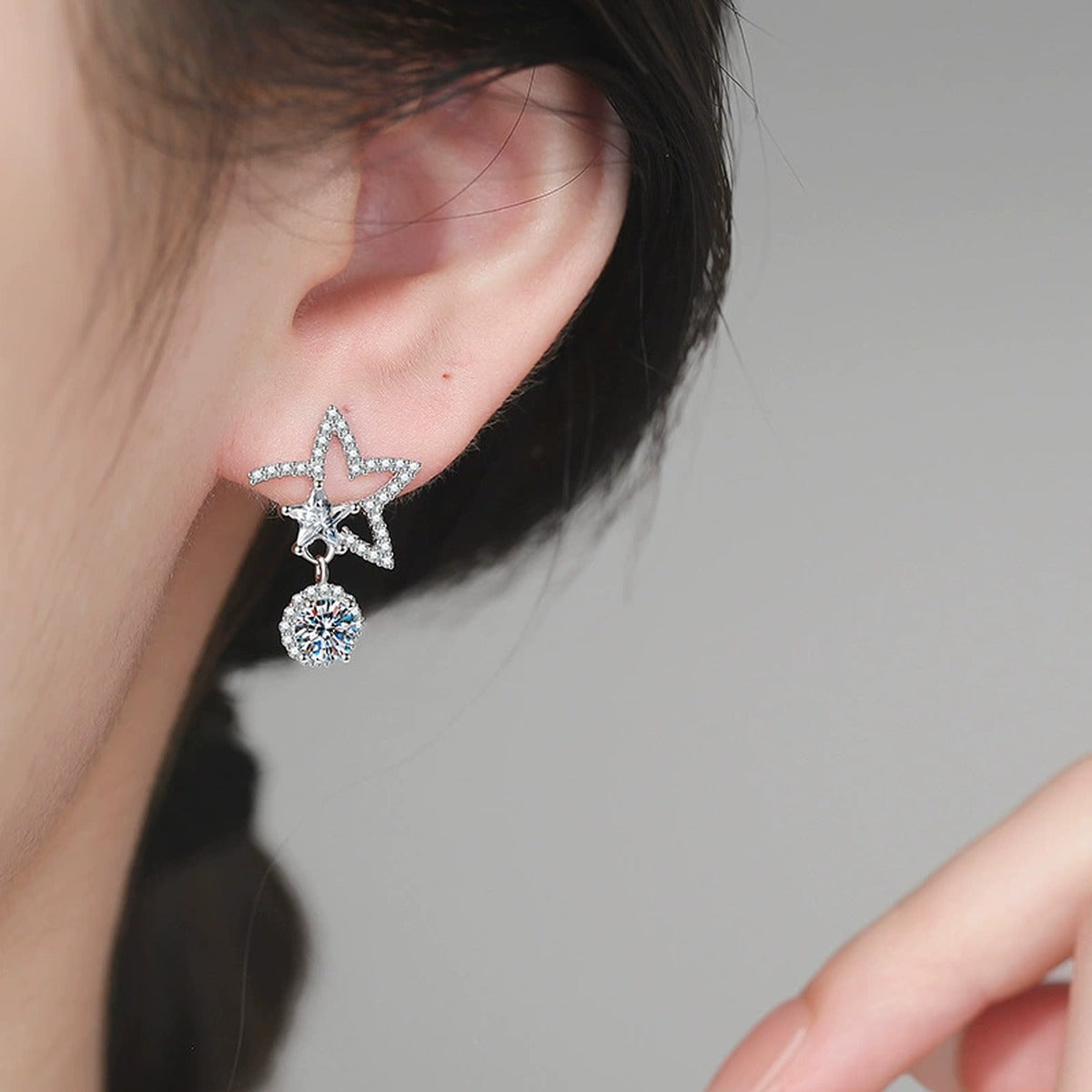 Star Moissanite Drop Earrings in White Gold-Plated S925 Sterling Silver with CZ worn on ear by model