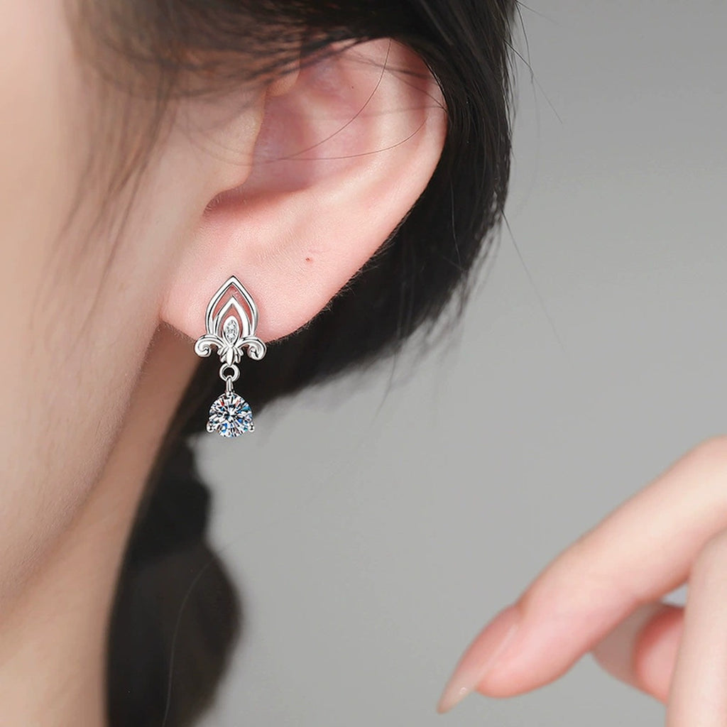 Fleur-de-Lis Moissanite Drop Earrings in White Gold-Plated S925 Sterling Silver with CZ worn on ear by model