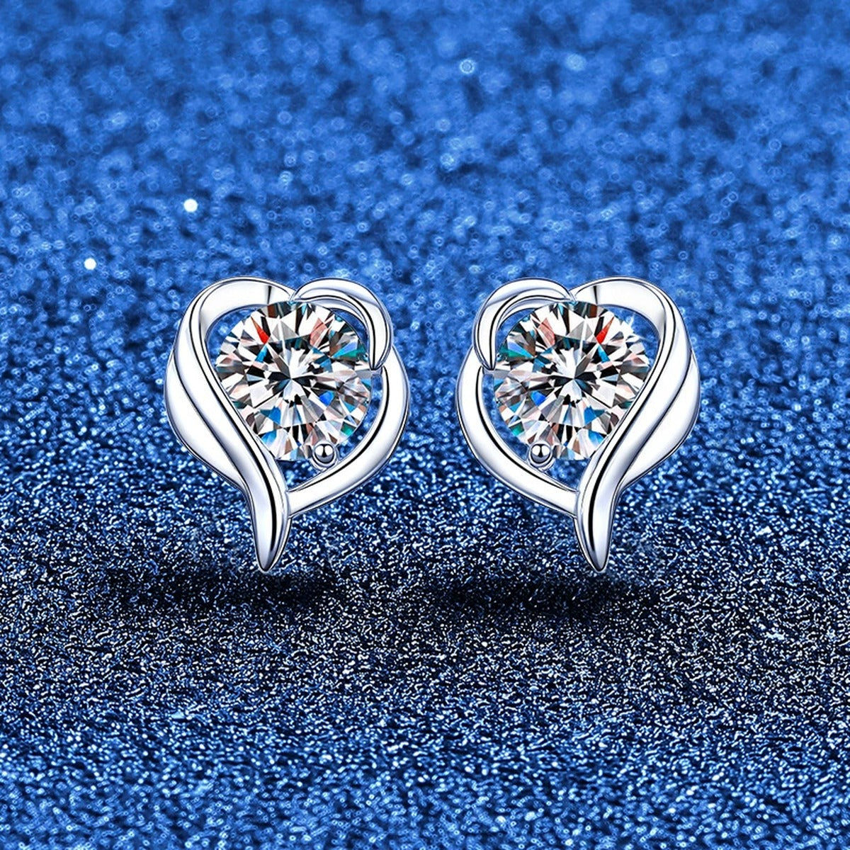 Swirl Heart Moissanite Stud Earrings in White Gold-Plated S925 Sterling Silver blue scene product view