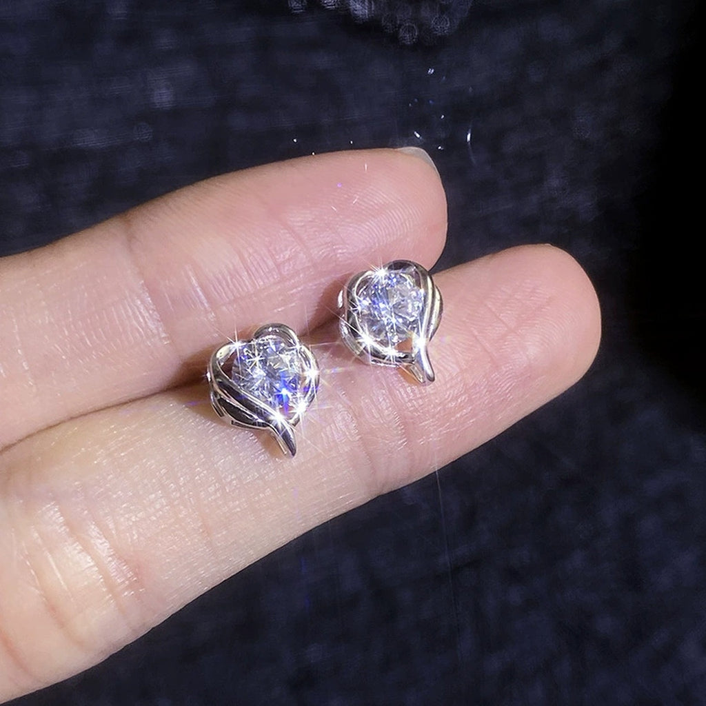 Swirl Heart Moissanite Stud Earrings in White Gold-Plated S925 Sterling Silver close-up product detail view