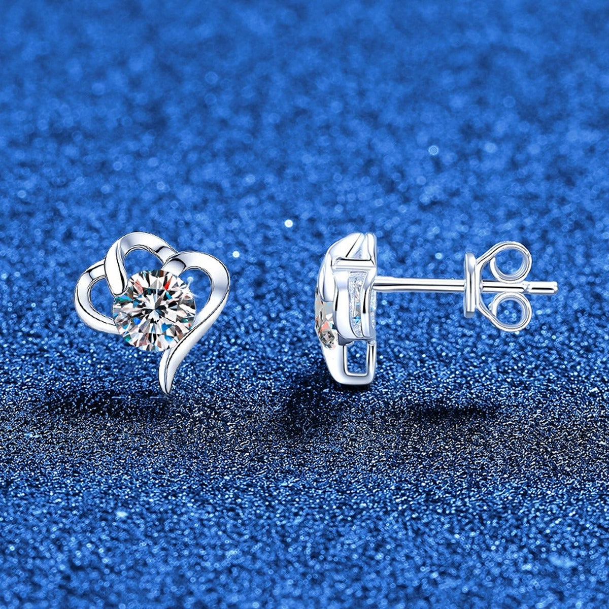 Open Heart Moissanite Stud Earrings in White Gold-Plated S925 Sterling Silver blue scene angled view