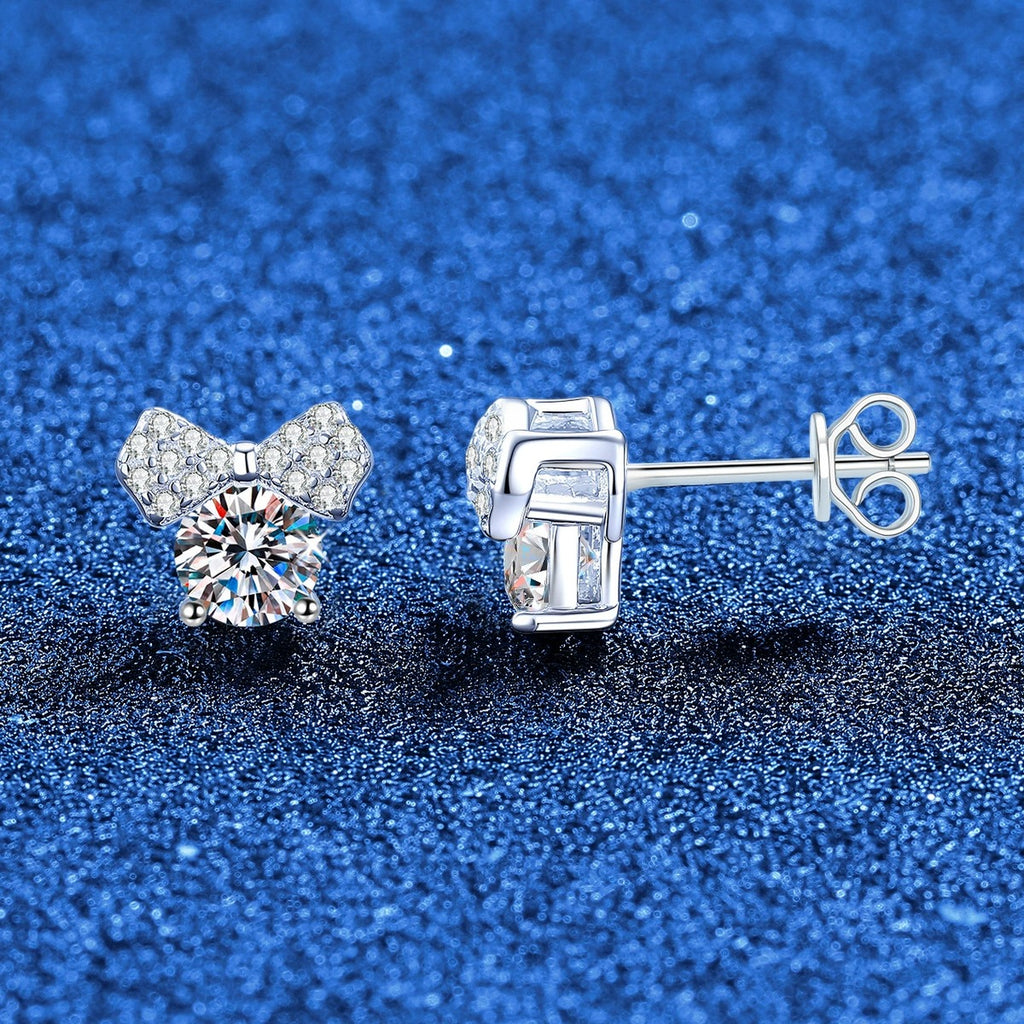 Bow Moissanite Stud Earrings in White Gold-Plated S925 Sterling Silver with CZ blue scene angled view