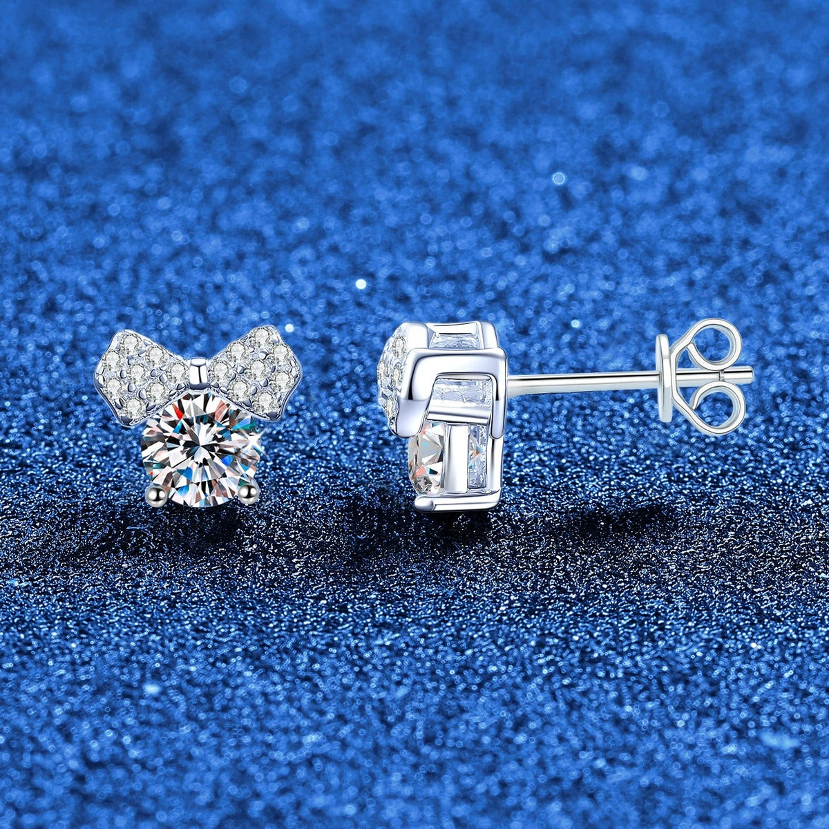 Bow Moissanite Stud Earrings in White Gold-Plated S925 Sterling Silver with CZ blue scene angled view