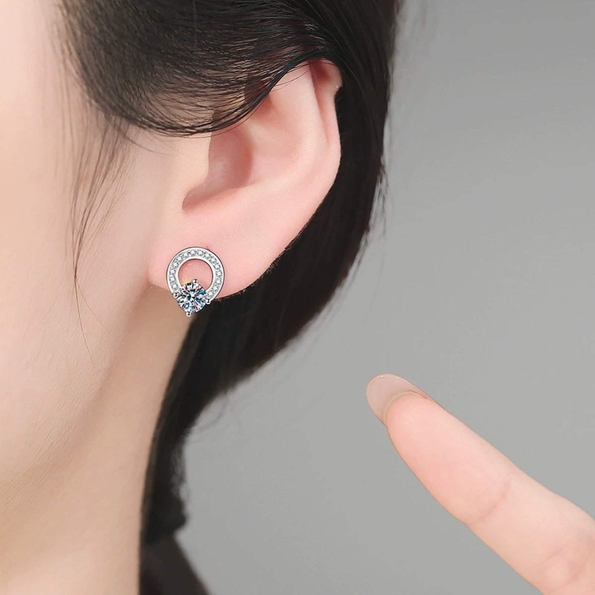 Open Circle Moissanite Stud Earrings in White Gold-Plated S925 Sterling Silver with CZ worn on ear by model