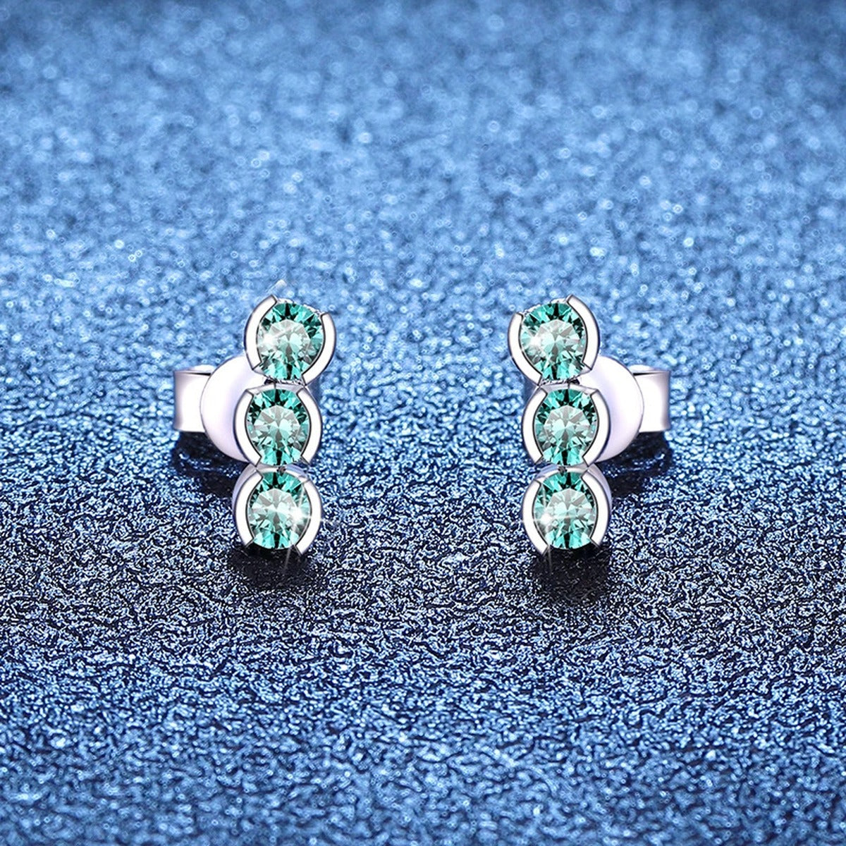 Green Moissanite Three-Stone Stud Earrings in White Gold-Plated S925 Sterling Silver blue scene product view