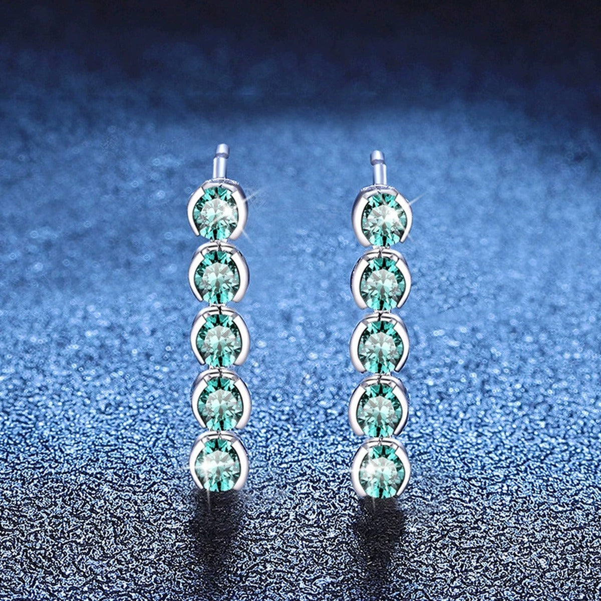 Green Moissanite Line Stud Earrings in White Gold-Plated S925 Silver blue scene angled view