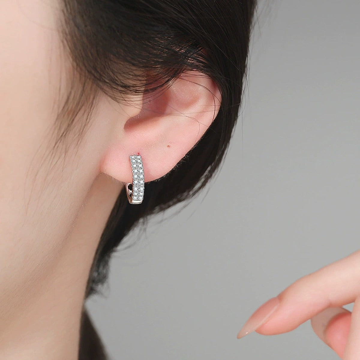 Pavé Moissanite Hoop Earrings in White Gold-Plated S925 Sterling Silver worn on ear by model