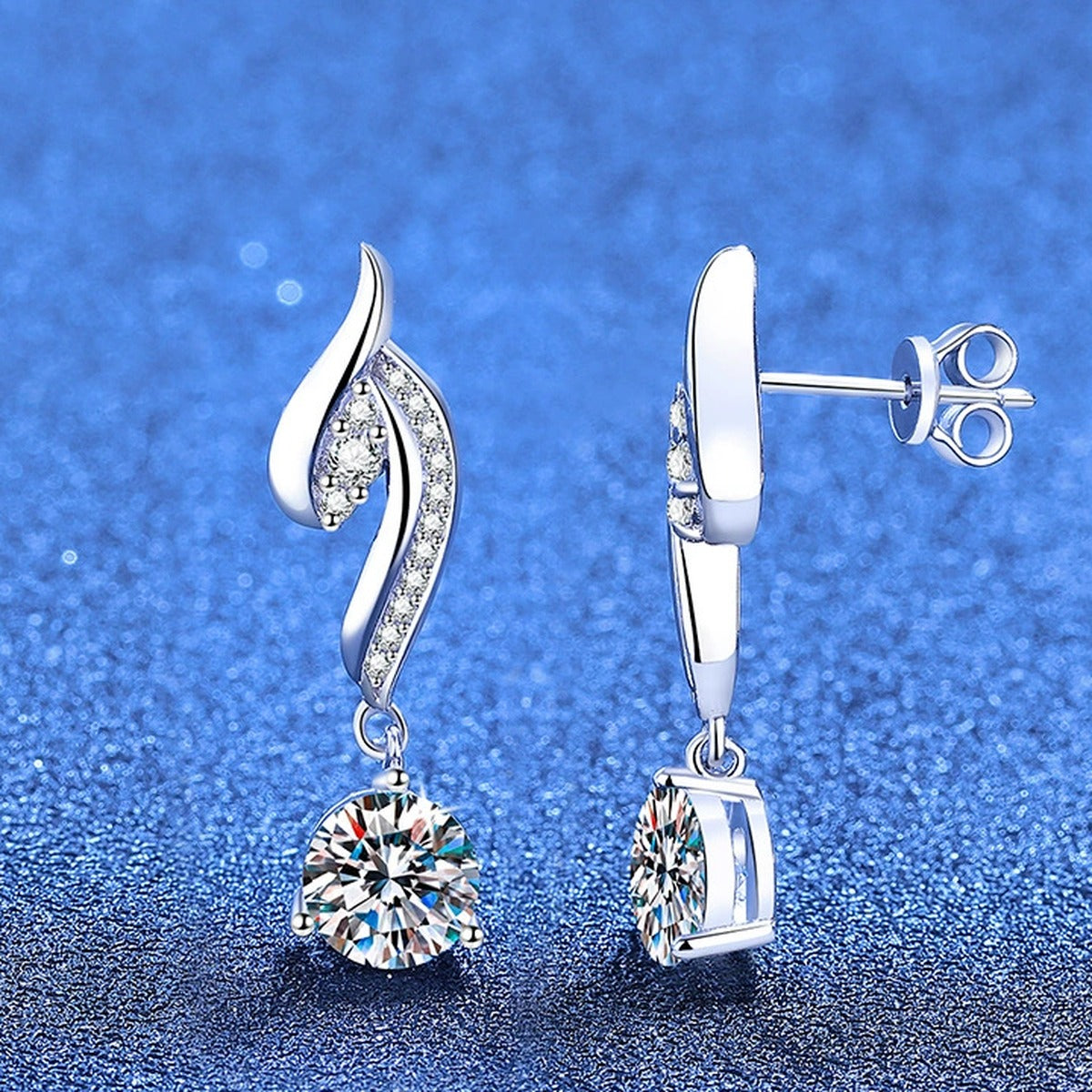 Swirl Moissanite Drop Earrings with CZ in White Gold-Plated S925 Silver blue scene angled view