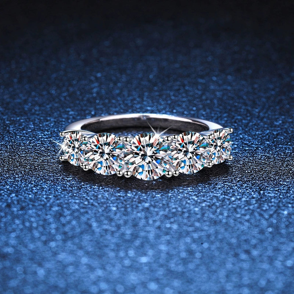 Graduated Five Stone Moissanite Ring blue background product view