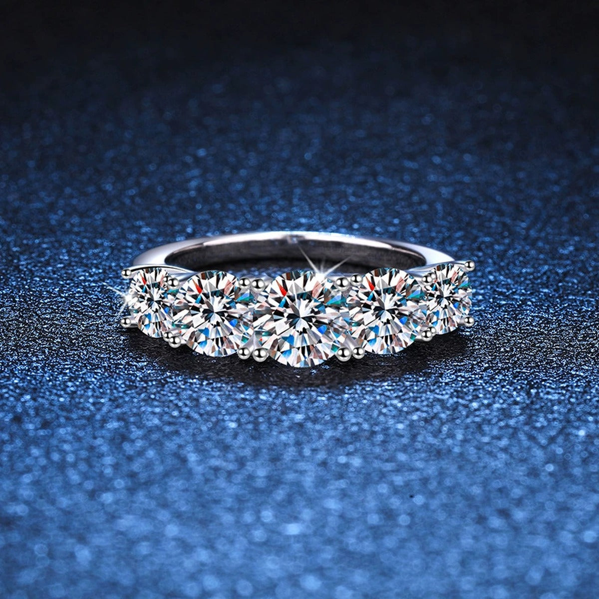 Graduated Five Stone Moissanite Ring blue background product view
