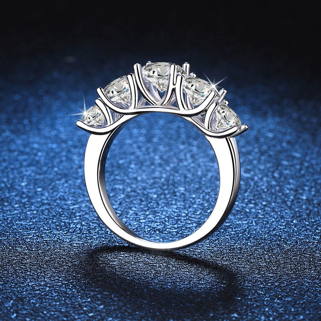 Graduated Five Stone Moissanite Ring blue background product view