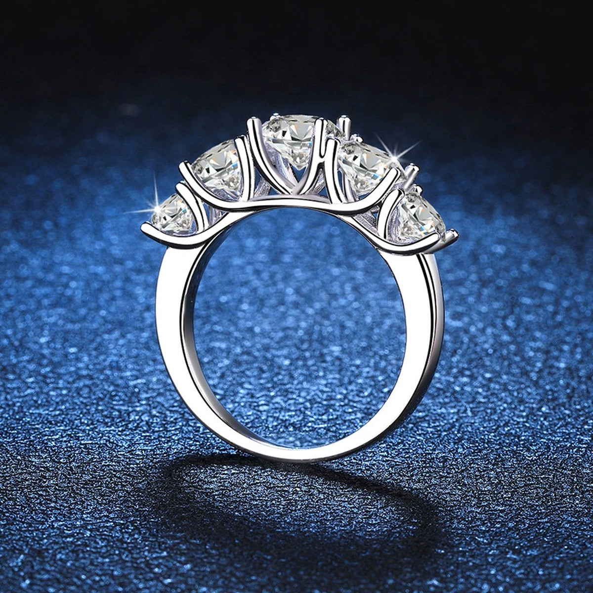 Graduated Five Stone Moissanite Ring blue background product view