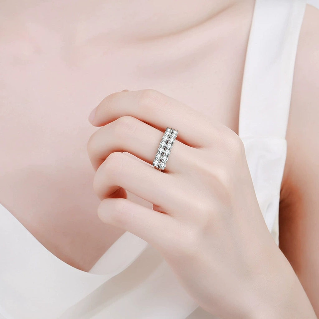Wide Pavé Moissanite Band Ring worn on hand by model