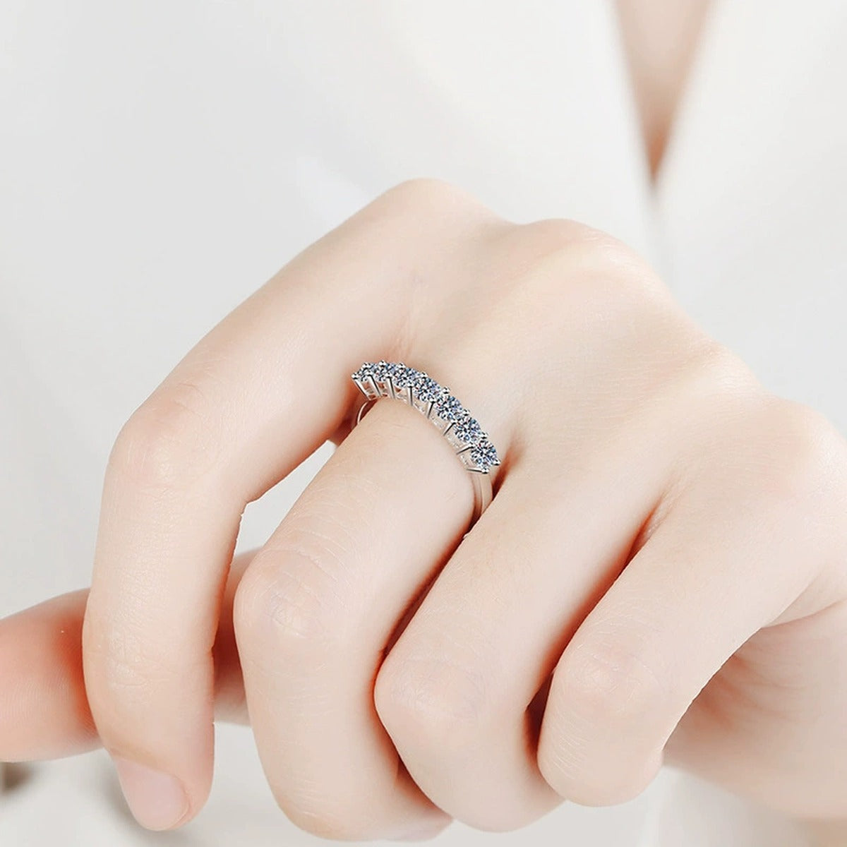 Graduated Moissanite Half Eternity Ring worn on hand by model