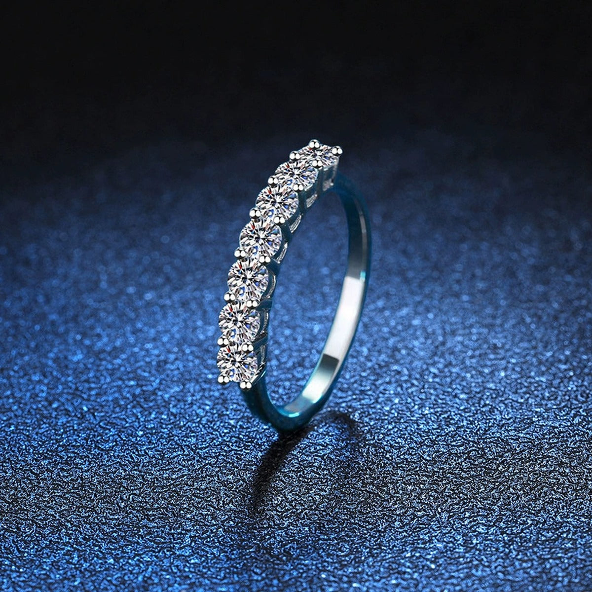 Graduated Moissanite Half Eternity Ring blue background product view