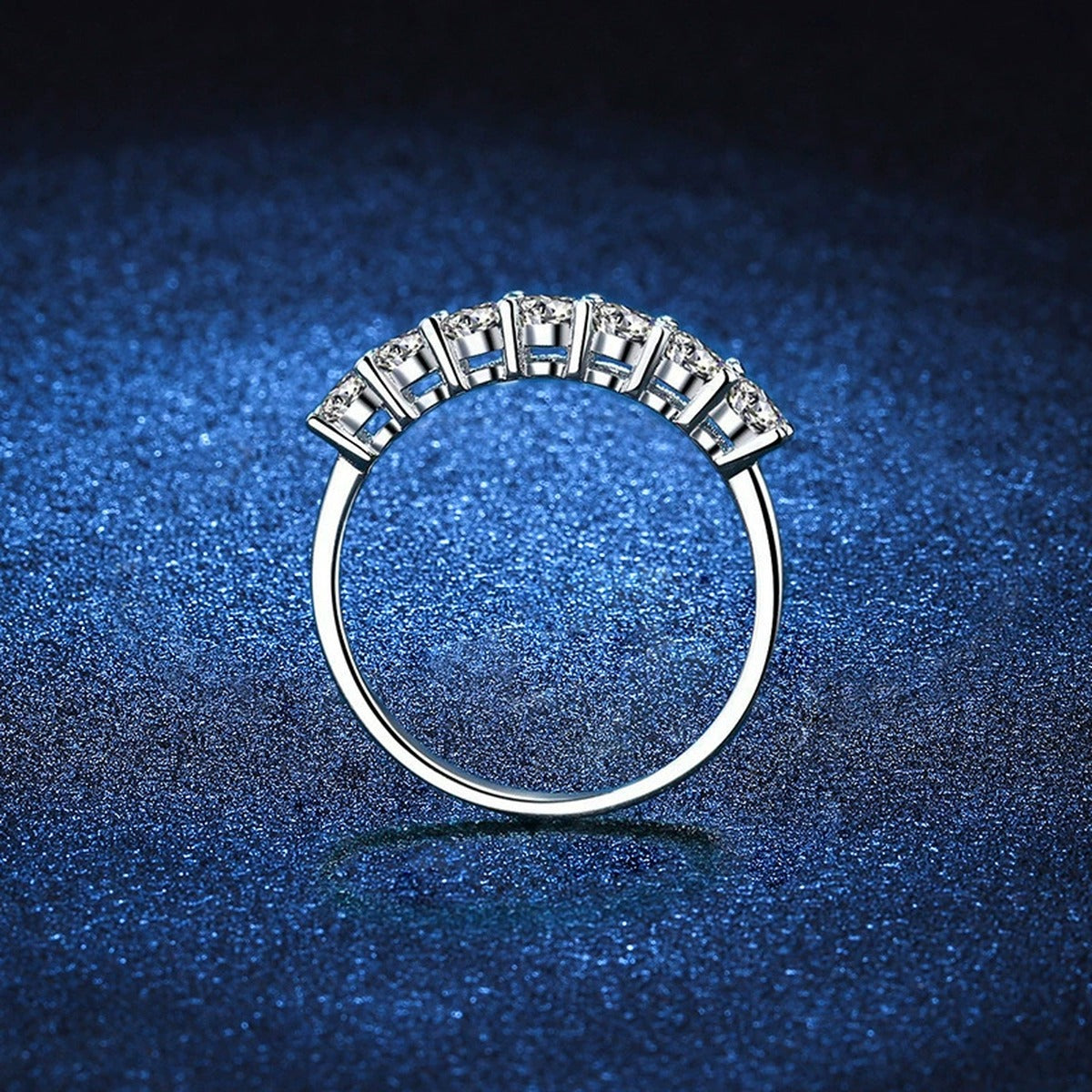 Graduated Moissanite Half Eternity Ring blue background product view