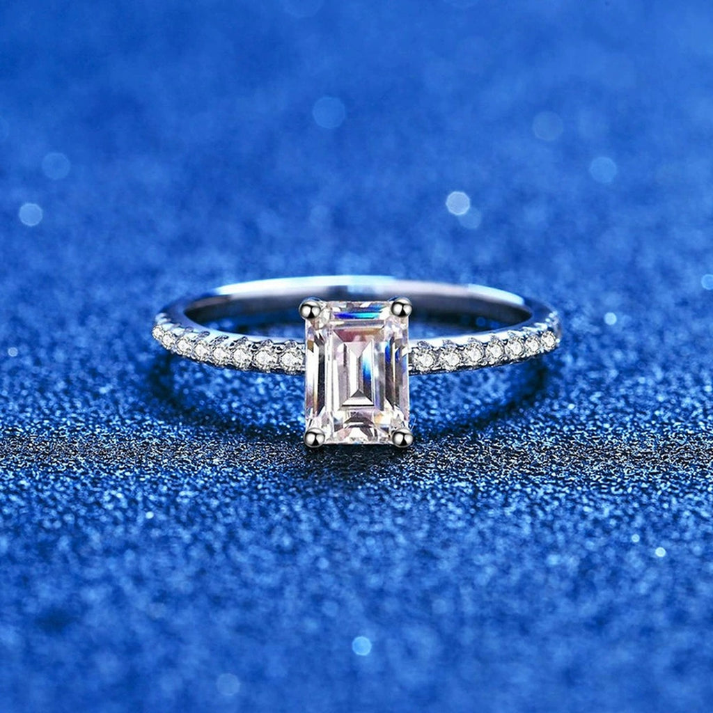 Emerald and Radiant Cut Moissanite Ring with CZ blue background product view