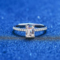 Emerald and Radiant Cut Moissanite Ring with CZ blue background product view