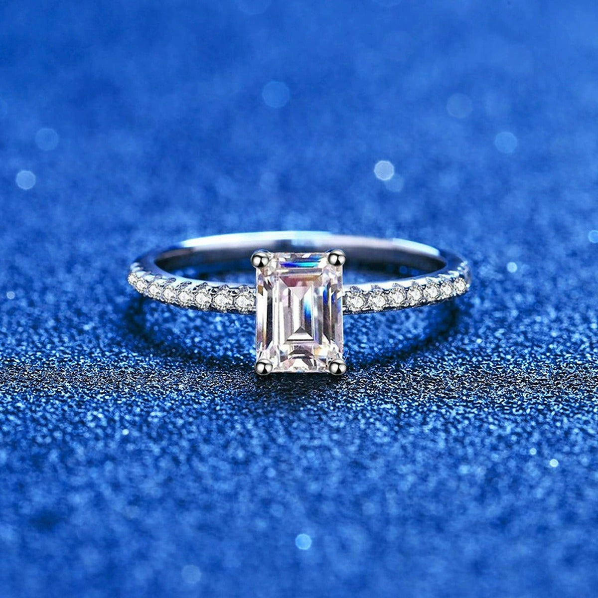 Emerald and Radiant Cut Moissanite Ring with CZ blue background product view