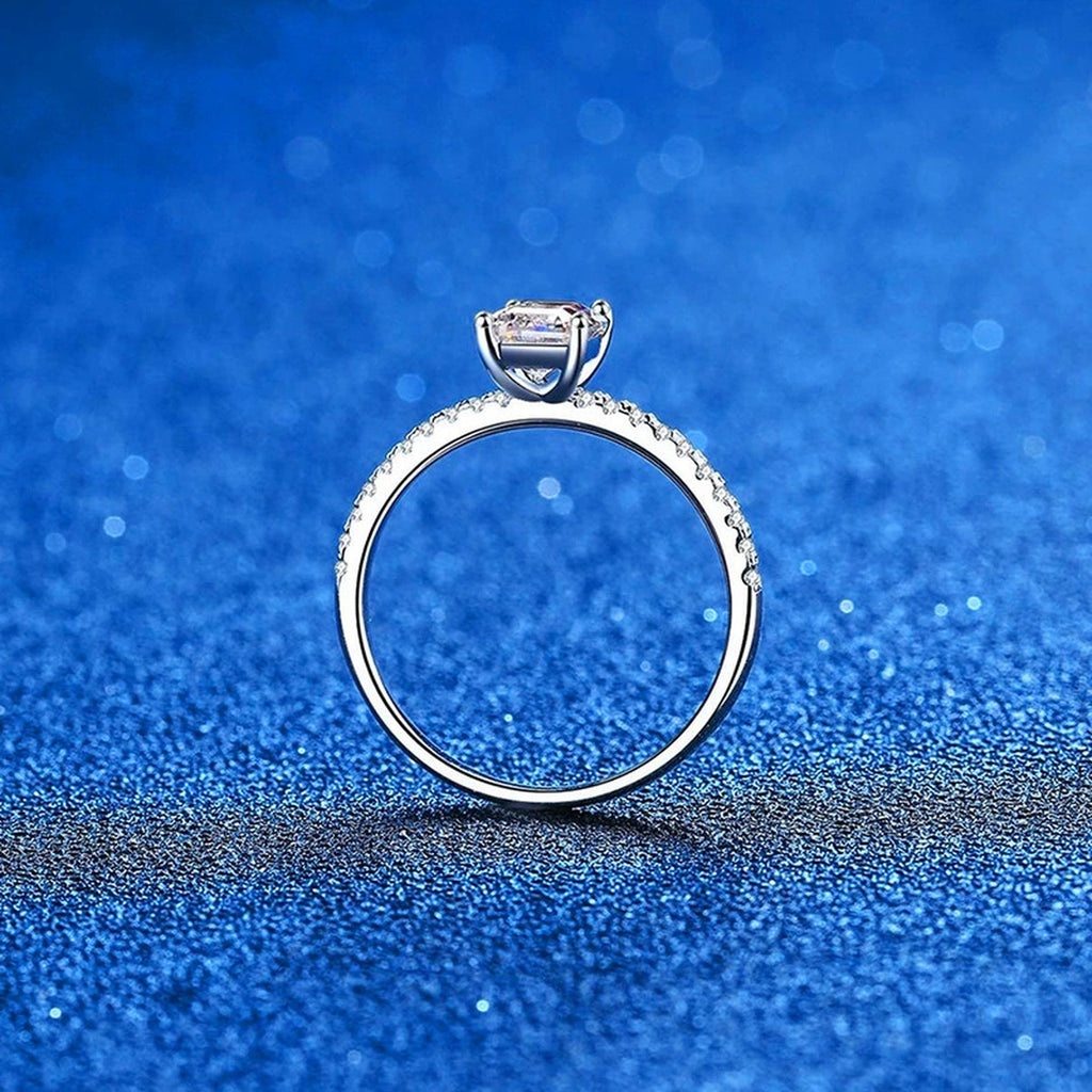 Emerald and Radiant Cut Moissanite Ring with CZ blue background product view