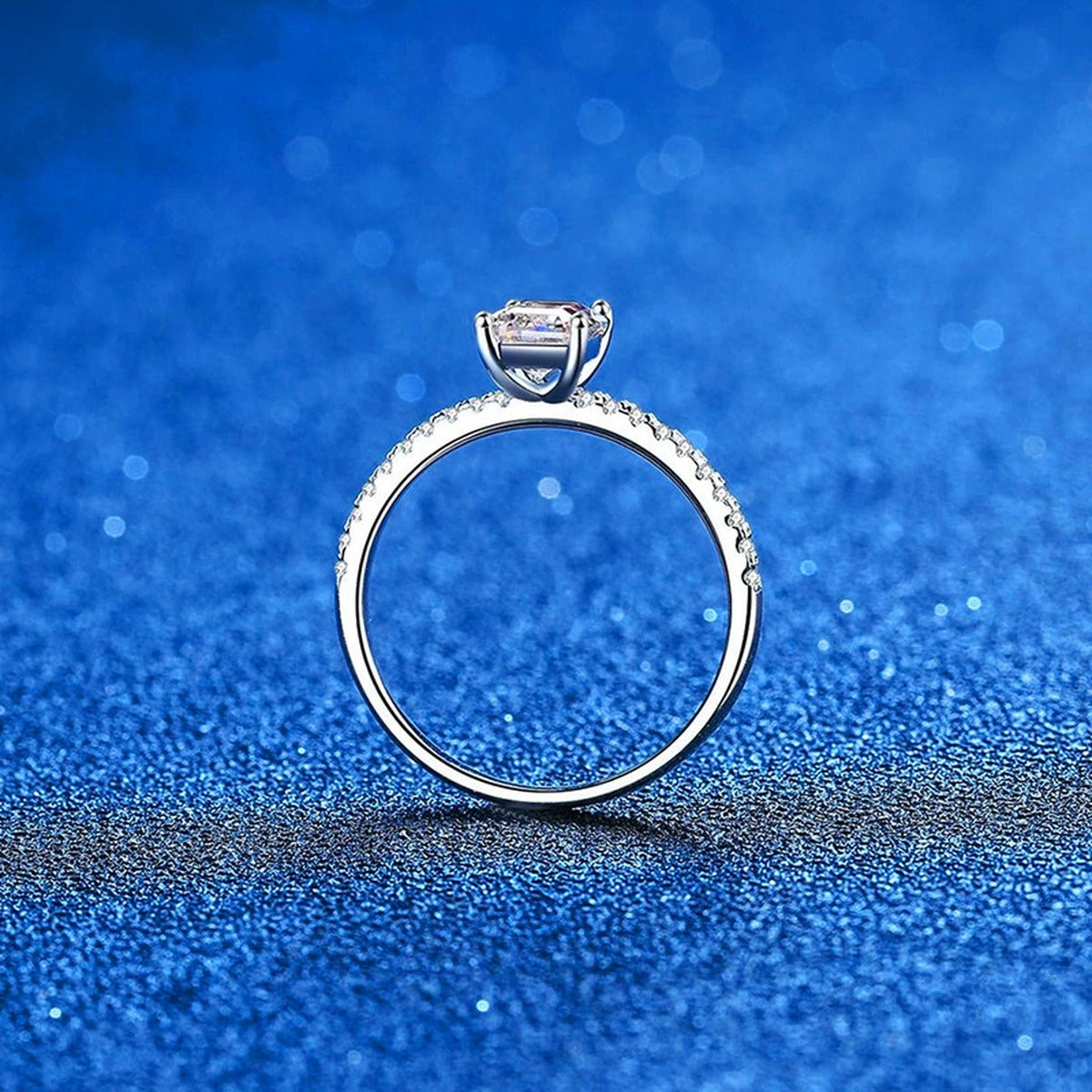 Emerald and Radiant Cut Moissanite Ring with CZ blue background product view
