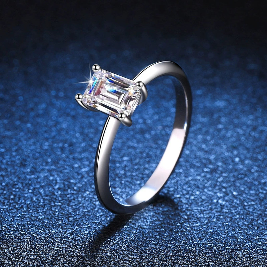 Emerald Cut Moissanite Solitaire Ring blue background product view