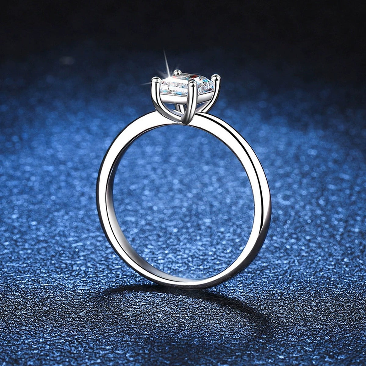 Emerald Cut Moissanite Solitaire Ring blue background product view