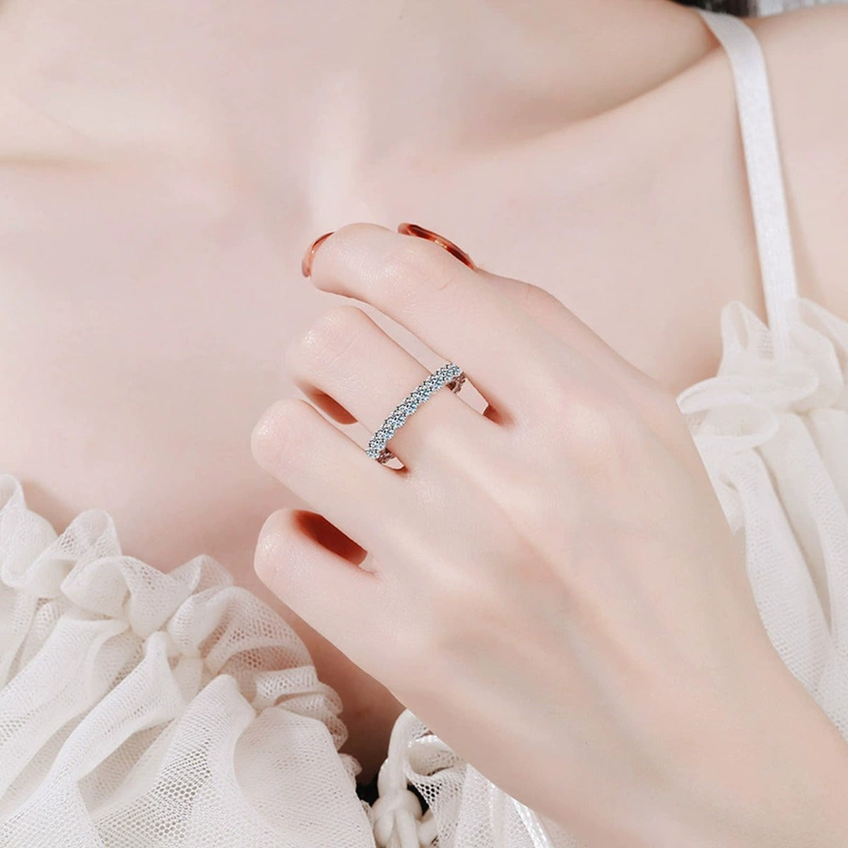 Full Eternity Round Moissanite Band Ring worn on hand by model