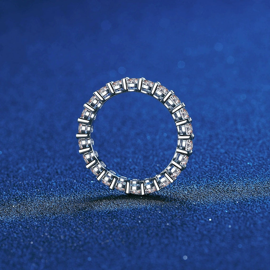 Full Eternity Round Moissanite Band Ring blue background product view