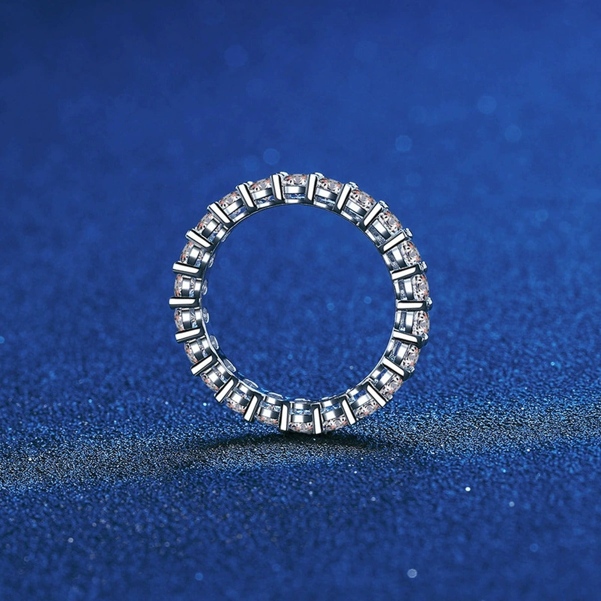 Full Eternity Round Moissanite Band Ring blue background product view