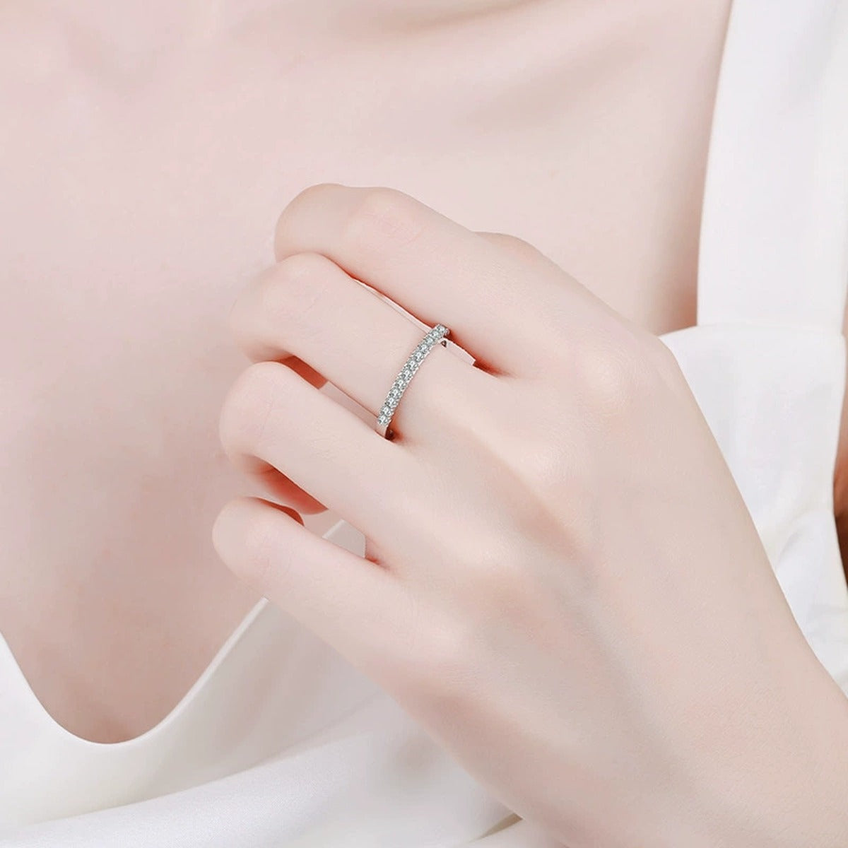 Moissanite Eternity Band Ring worn on hand by model