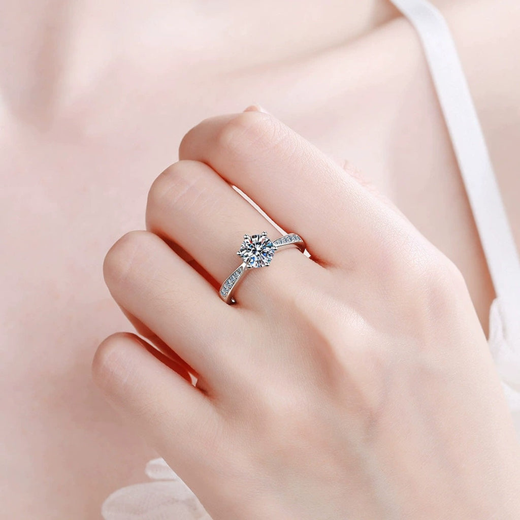 Round Moissanite Solitaire Ring with CZ worn on hand by model
